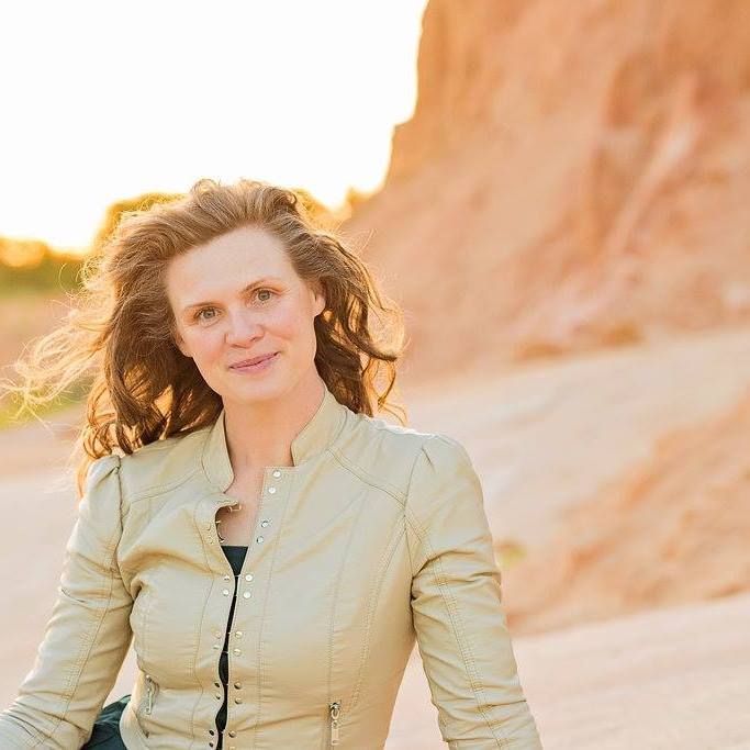 Portrait of Denee Richardson, creator of WordSong, outdoors at golden hour